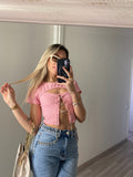 Top rosa con punto luce