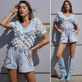 Camicia celeste a manica corta con fiori
