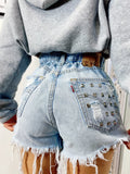 Short Levi’s Vintage bagno chiaro con borchie