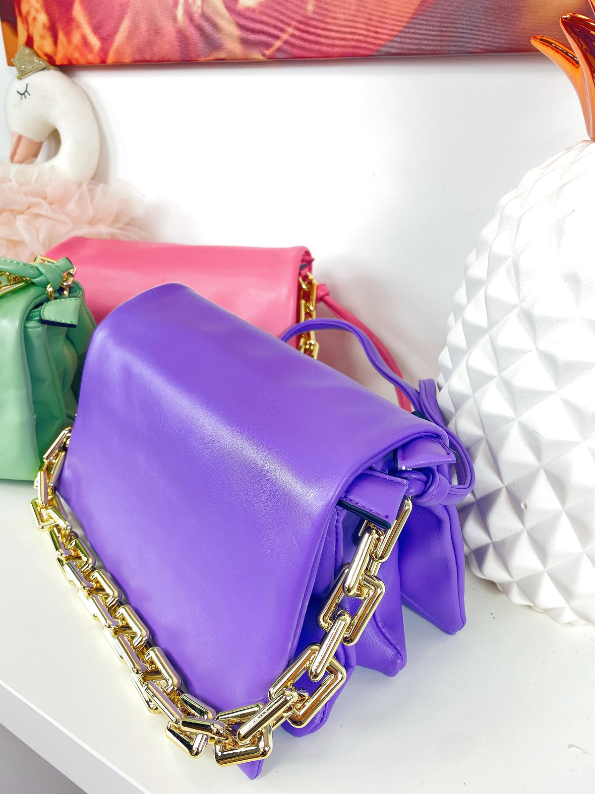 Pochette a mano con catena colori accesi