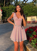 Abito rosa glitter con fiocchetti