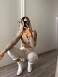 Maglioncino nude con bottoni gioiello