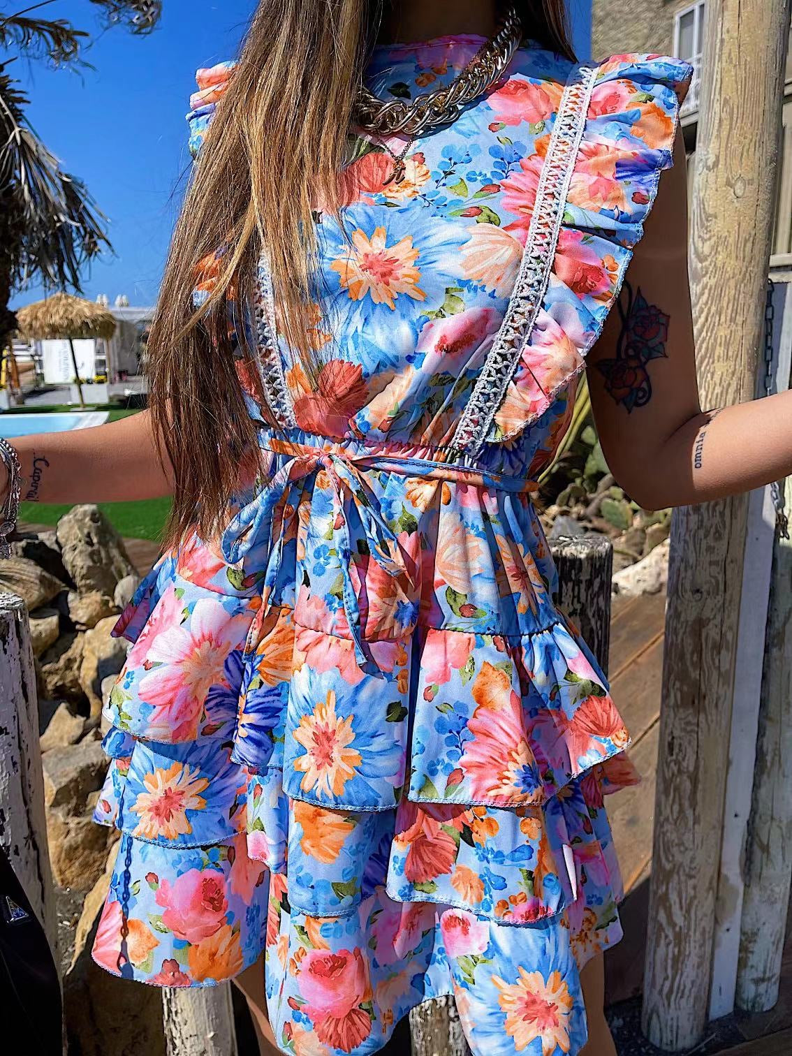 Abito a fiori azzurro schiena aperta