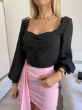 Top con bottoncini nero