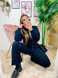 Jogger gamba larga e croptop nera