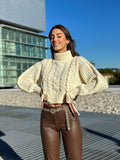 Maglione panna con trecce