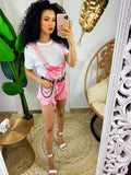 Salopette in jeans rosa sfrangiata