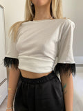 T-shirt con piume nere