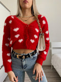 Cardigan rosso con cuori
