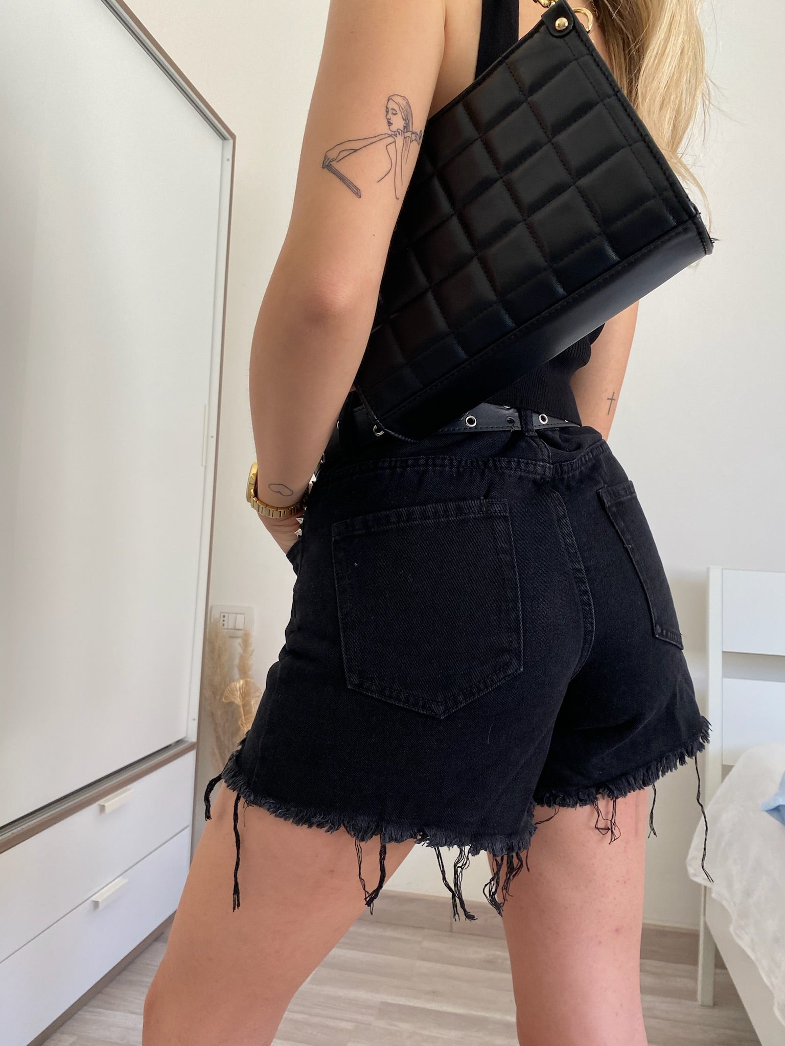 Jeans nero con borchie
