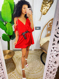 Abito in raso rosso con rouches