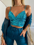 Top con paillettes petrolio