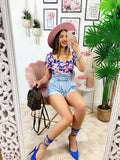 Top floreale con cintura