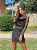 Abito in velluto nero con trasparenze