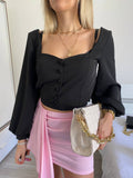 Top con bottoncini nero