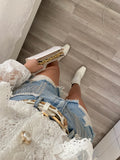 Short in jeans con frange