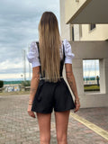 Salopette nera più camicia fiocchetto