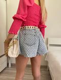 Short jeans a farfalla con strappini