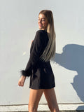 Blazer con piume