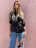 Blusa o kimono con frange