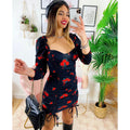 Abito arricciato con fiori rossi