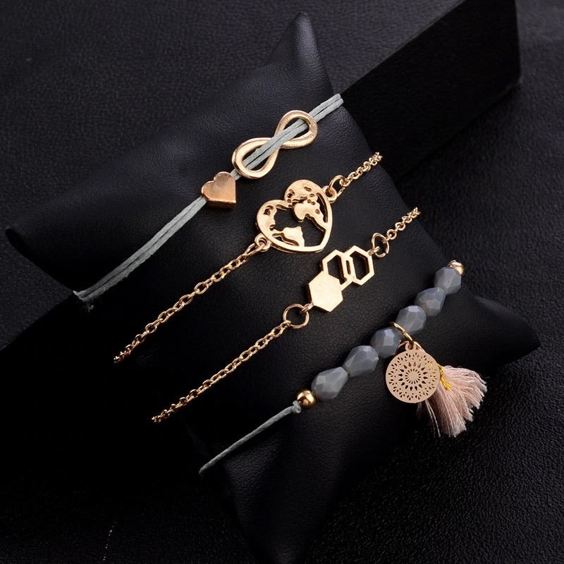Bracciale con infinito e dettagli rosa grigio