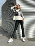Maglione a righe collo alto