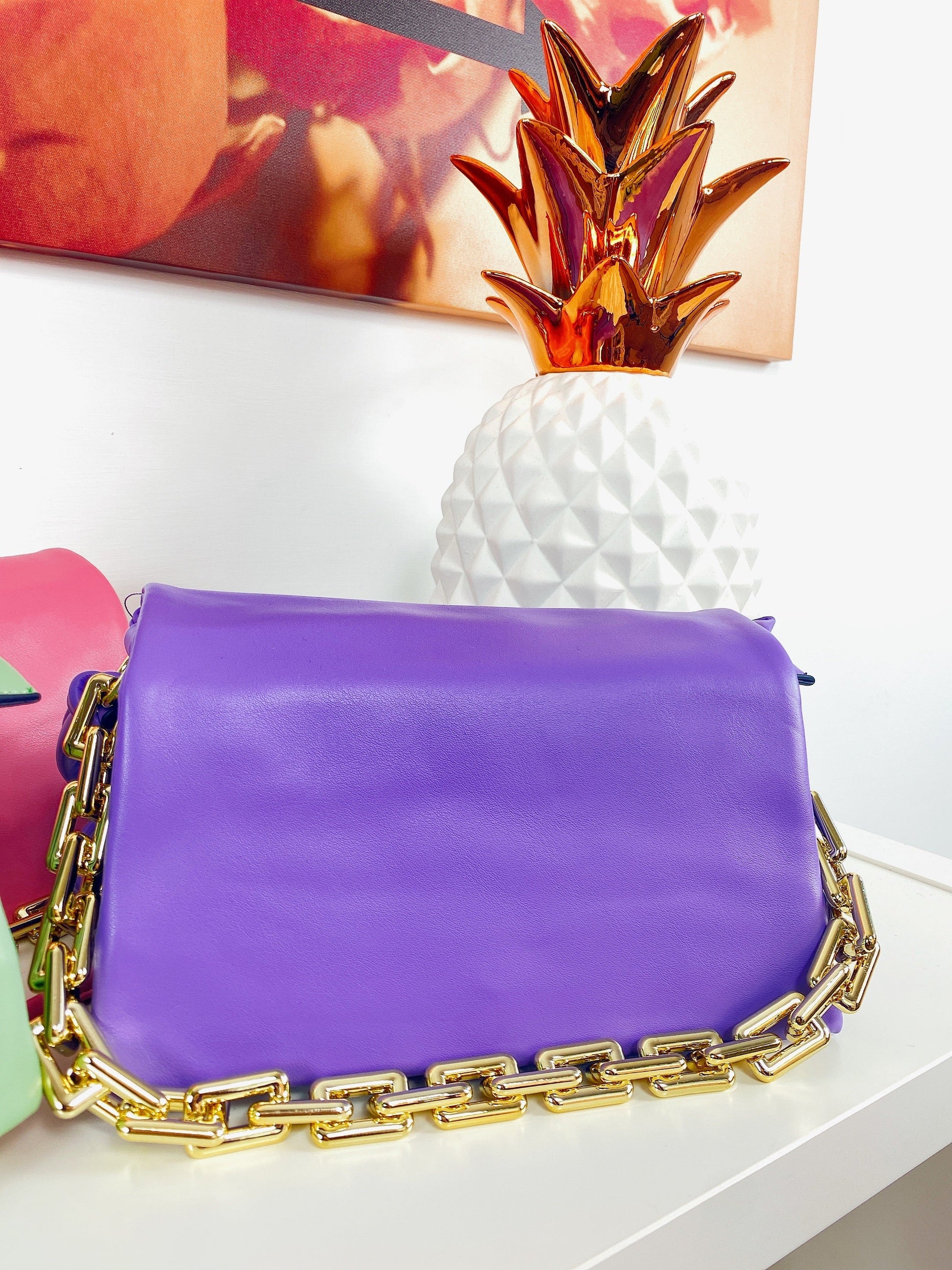 Pochette a mano con catena colori accesi