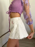 Short bianco a farfalla con strappini