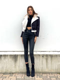 Pantalone in ecopelle con borchie