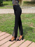 Pantaloni a zampa con strass