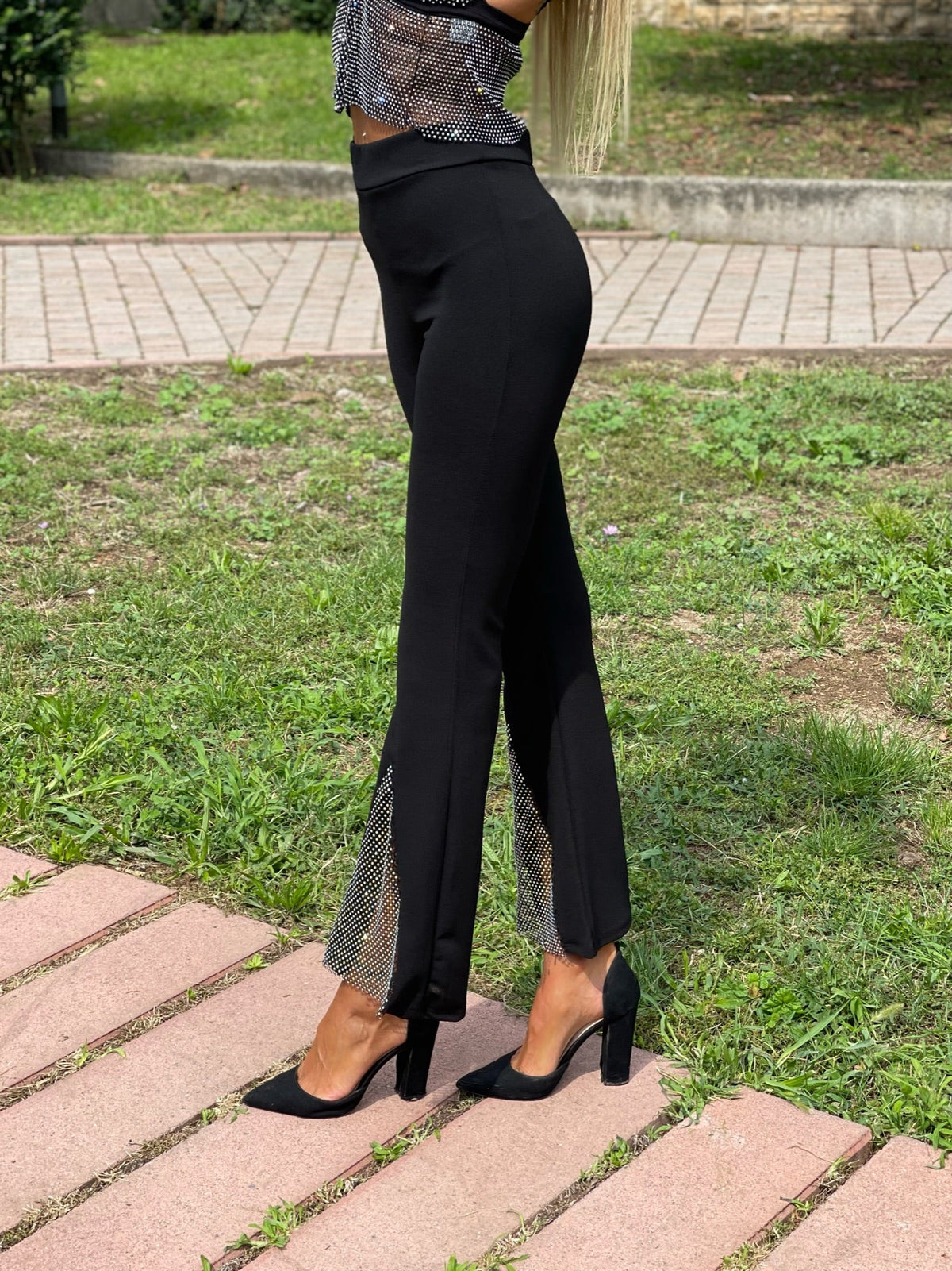 Pantaloni a zampa con strass