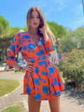 Abito arancio fiori azzurri
