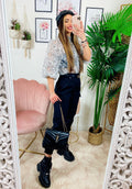 Pantalone con tasche laterali e cintura nero