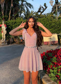 Abito rosa glitter con fiocchetti