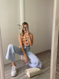 Jeans con aperture laterali