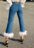 Jeans con piume bianche