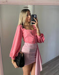 Top con bottoncini rosa