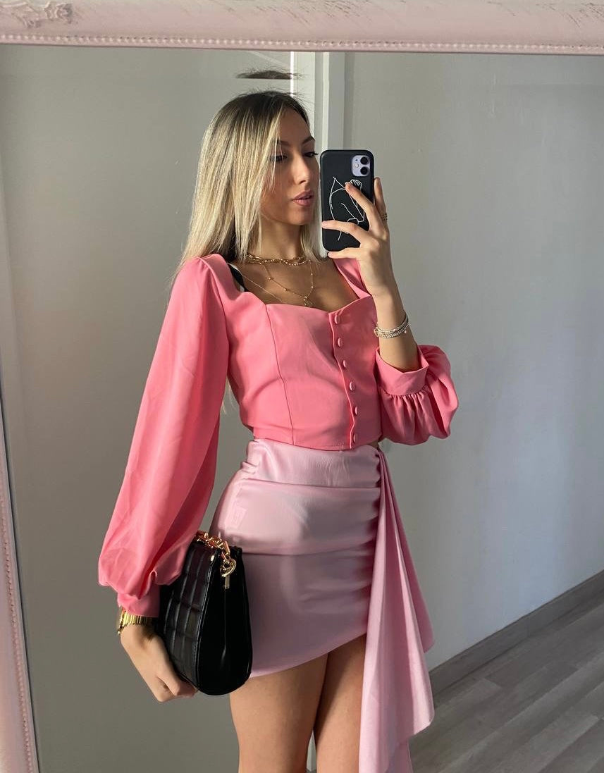 Top con bottoncini rosa