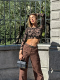 Top nude ricami nero