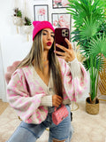 Cardigan maculato rosa con gioiello