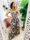 Tuta floreale con pantalone a pieghine