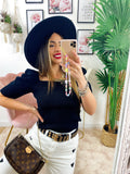 Top con spalline bombate Nero
