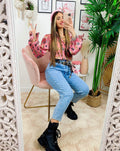 Jeans con borchie posteriori grandi