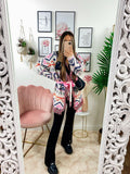 Cardigan A rombi dettagli rosa con frange e cinta