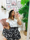 Camicia smanicata con borsetta bianca