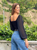 Blusa con scollo a V maniche velate