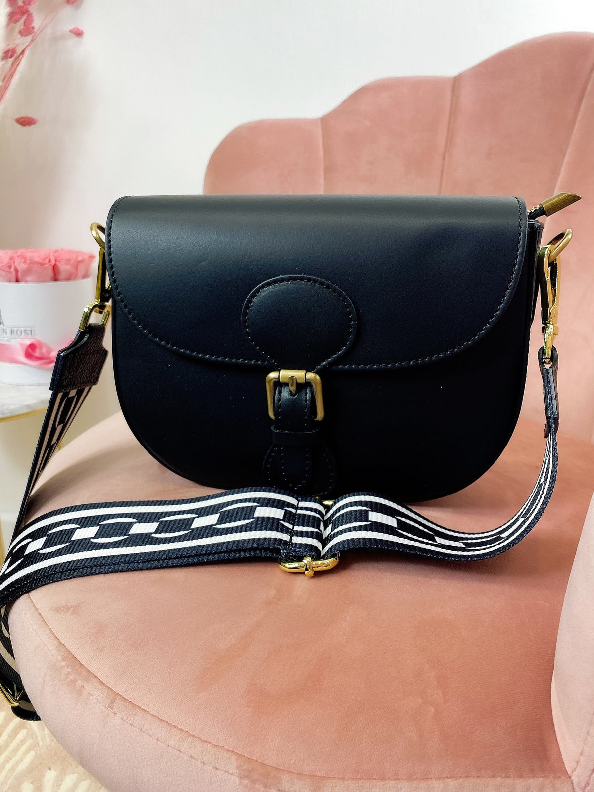 Pochette in pelle con cintura a fantasia