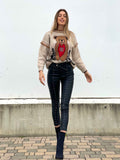 Pantalone in ecopelle con borchie
