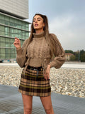 Maglione beige con trecce